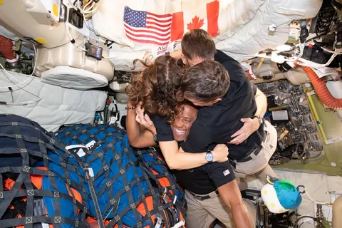PsBattle: Astronauts group hug during Artemis II mission