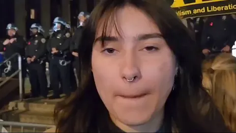 Pro-Palestine protester has no clue why she is protesting and then asks a friend why they are protesting who also has no clue