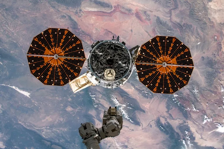 Cygnus departing after release from Candarm-2