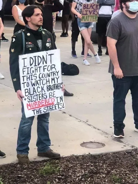 A veteran protesting his government after fighting for it shows the united fight for equality.