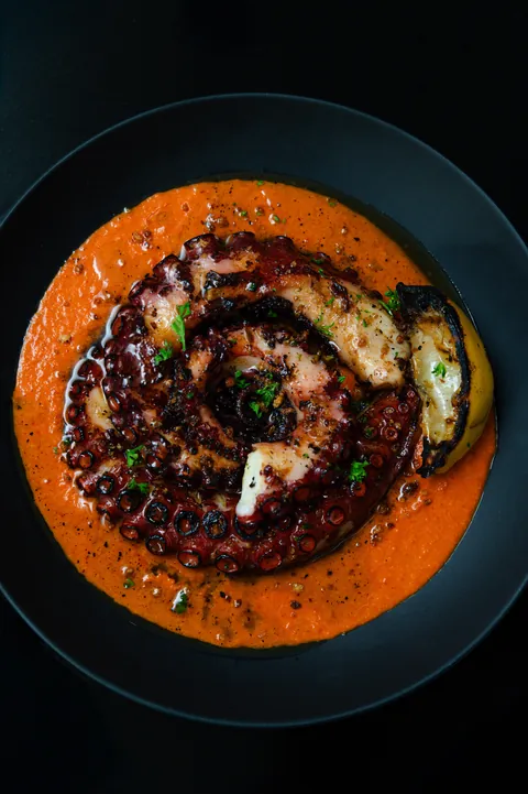 [homemade] Char-grilled octopus with romesco sauce.