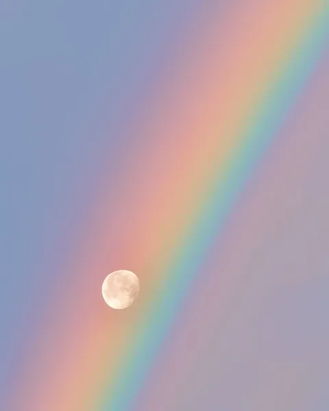 Moon and rainbow in harmony