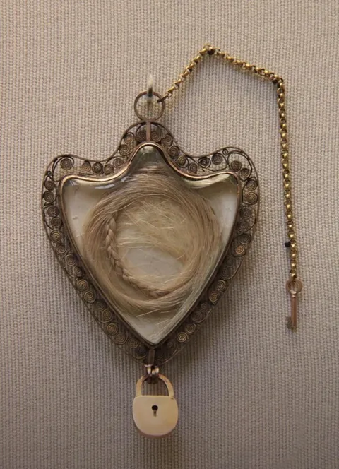 Hair of Marie Antoinette in a golden locket