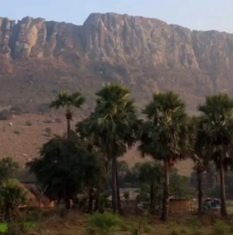 After losing his wife due to delayed medical help, Dashrath Manjhi spent 22 years carving a mountain in Bihar using simple tools, reducing the distance to the nearest hospital from 70 km to 15 km and helping his entire village.
