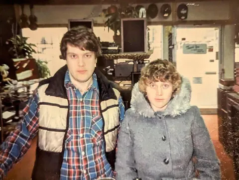 Parents in 1981. Pawned their camera and the shop owner took their picture to make sure the camera worked