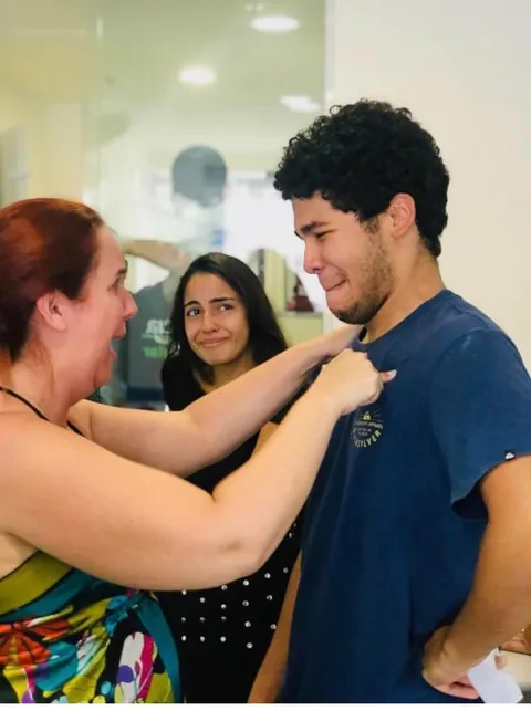 Gabriel Nobre, 19, with his mom and sister right after he found out he’d passed Brazil’s famously difficult university entrance exam. The young man had cut a deal with a prep course to clean the building in exchange for free classes to help him prepare for the exam.