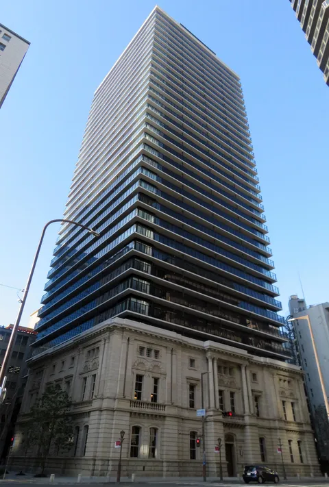 The Parkhouse Kobe is a high-end residential tower in Kobe, Japan, whose podium was constructed to resemble an old bank built in the 1900s which used to stood on the same plot of land. Image credit to Wikipedia