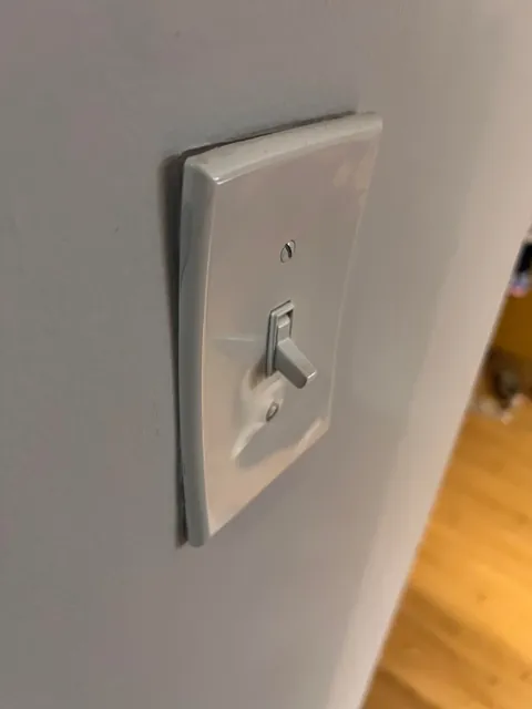 Multiple Light Switch Covers and Outlet Plates Warped at Once — What Could Cause This?
