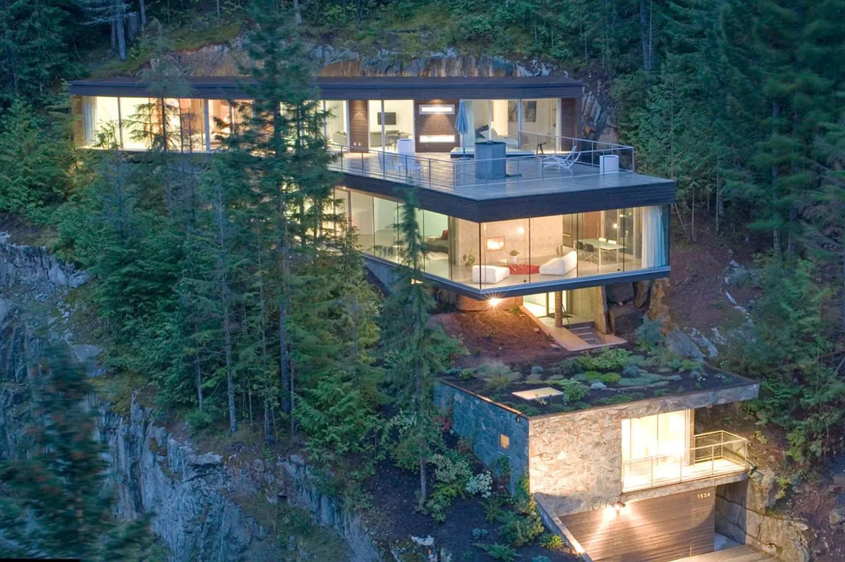 Cascading residence with five levels built on a slope offering views of the conifer forests of Whistler, British Columbia, Canada [1800×1198]