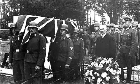 A member of the Royal Air Force is interred with full military honors by German forces. Channel Islands (1943)