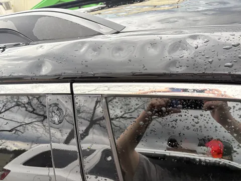 A storm with egg sized hail wrecked my car while at work