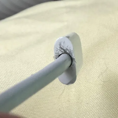Name-brand Apple charger frayed after only a couple months.