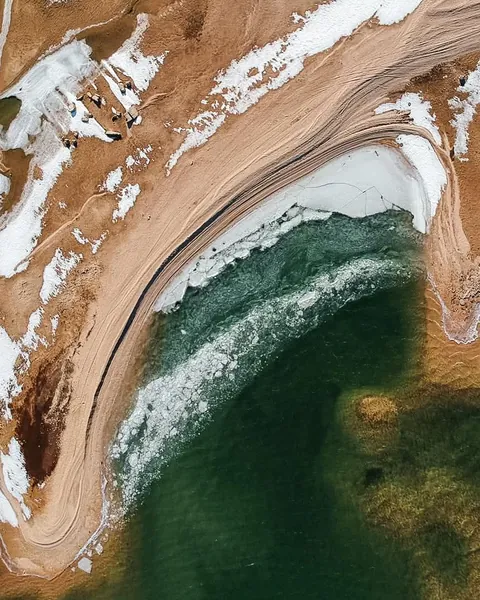 Frozen beach in Bosnia. A lake near my hometown of Livno [OC][859x1073]