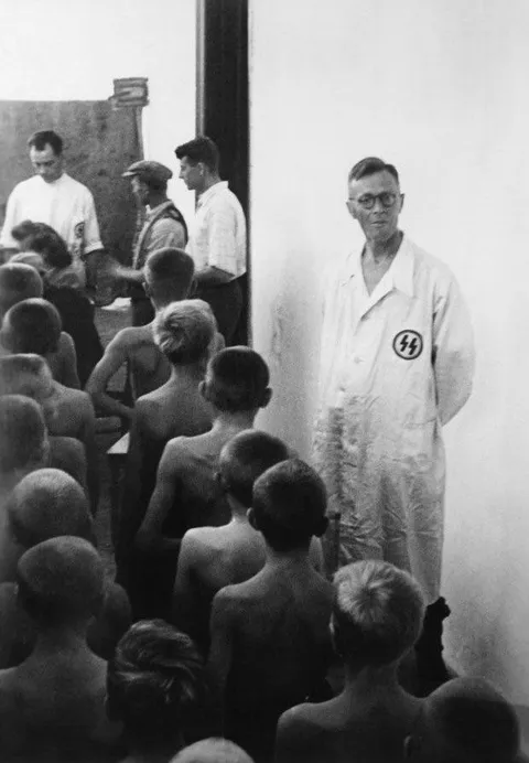 SS doctors selecting Polish children with “Aryan” features for abduction and adoption by German families