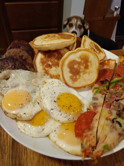 Pancakes, eggs, sausage, and pizza