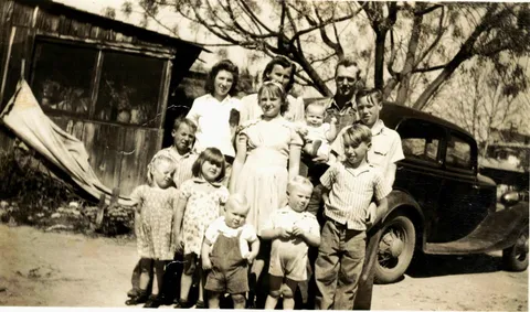 My Dad's family leaving Missouri for California cicra 1944.  My dad, 1st row all the way to the right.  Crazy thing is there are 8 older kids not in the picture. 