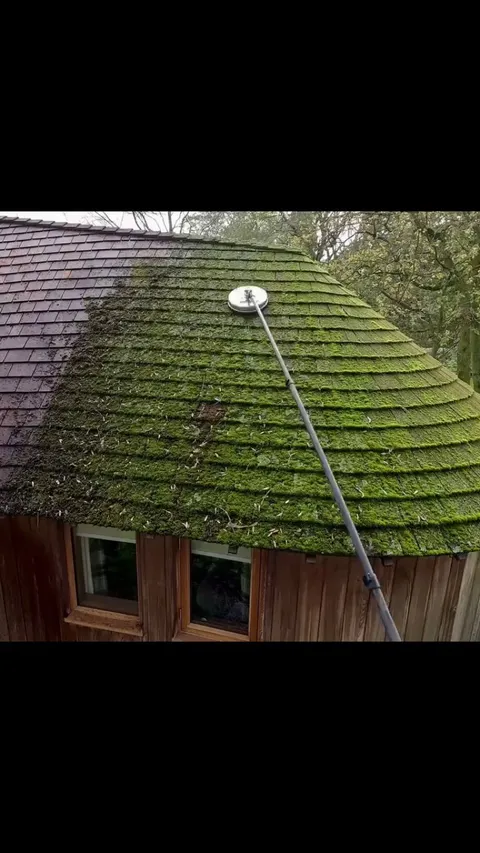 Guy shows the process of cleaning a roof