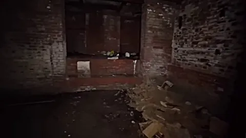 Explorer rounds a corner in an abandoned building — not what he expected