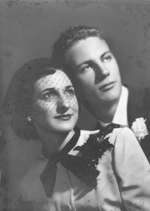 The parents on their Wedding day in 1952. She was 18 he was a manly 16..