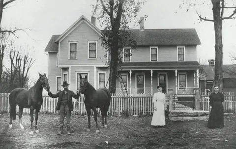 A family in front of their new house, 126 years ago. (1900)
