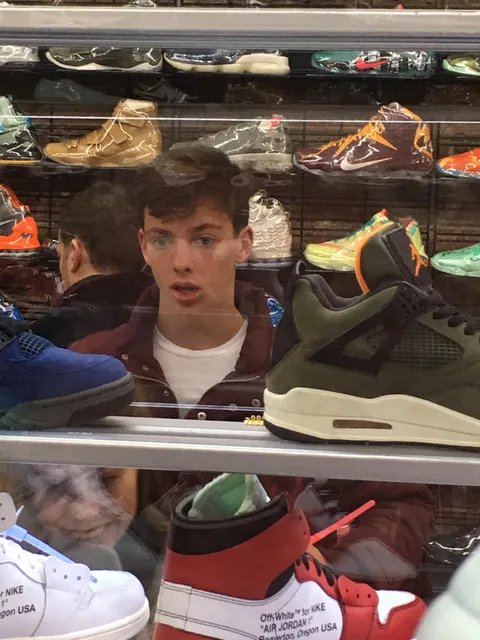 Going along with /u/simonsen6 being star struck during his visit to Flight Club in NYC, here’s a picture of me that my mother took during my visit there in February. Those OW AJ1s had me shook. I don’t see a lot of stuff like that in Nebraska.