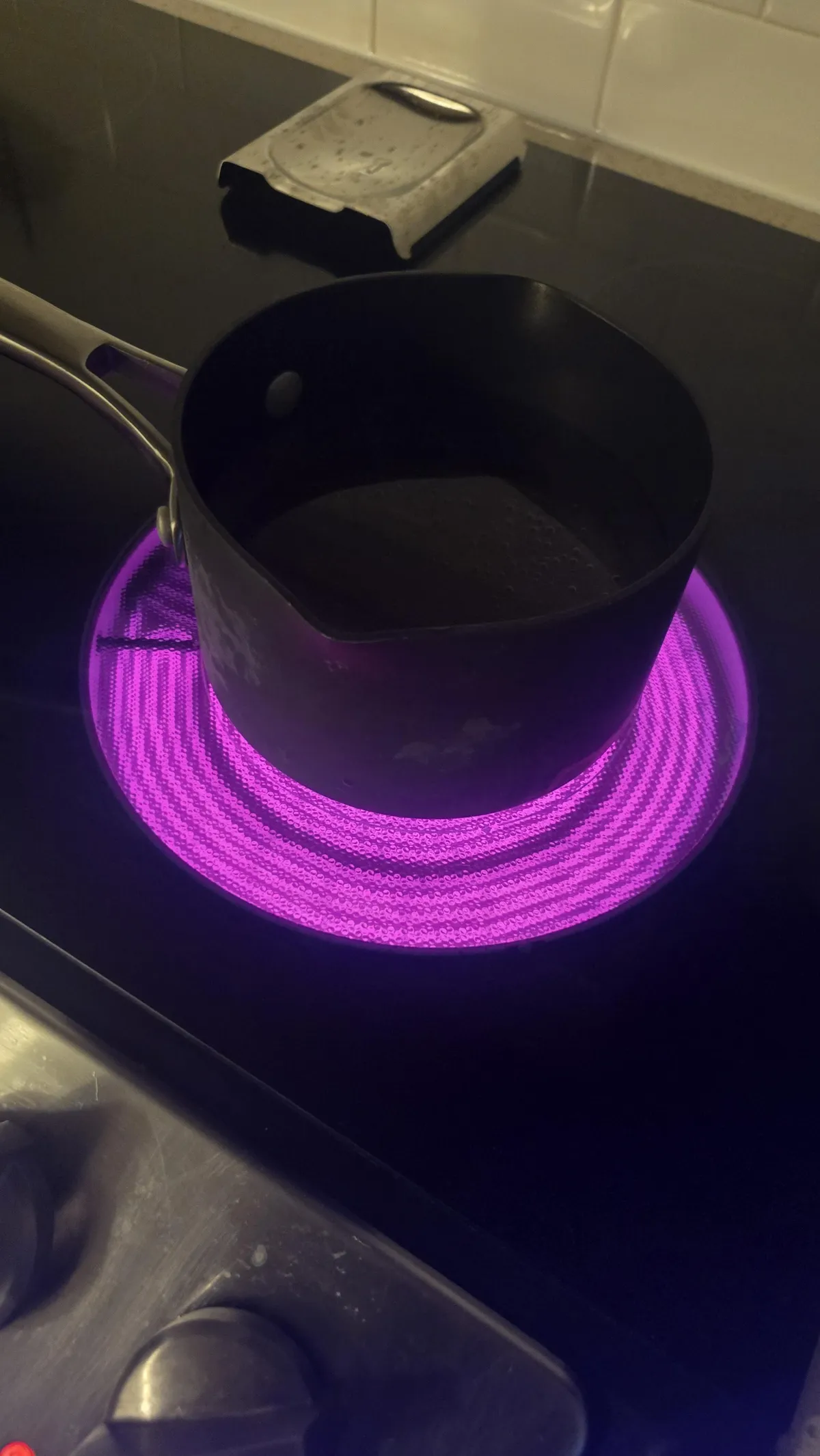 My stoves heating element is purple on my phone's camera but my eyes see it as red