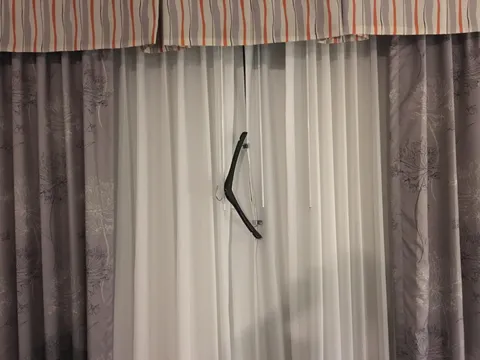 Hotel curtain won’t stay closed. No problem.