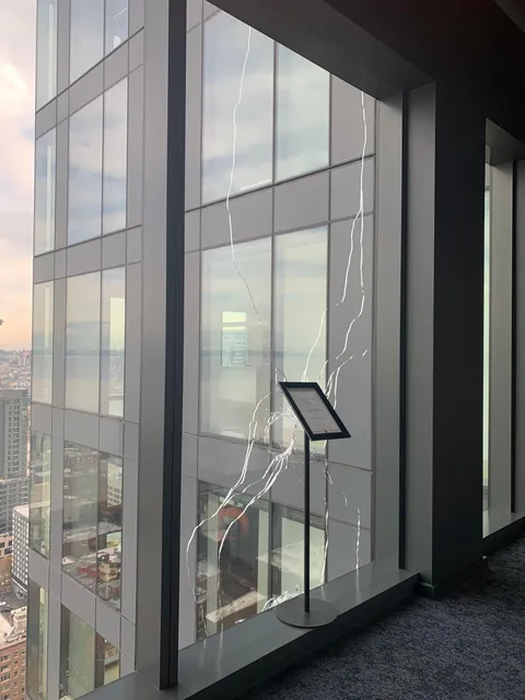 What can this giant hole on the 31st floor of my apartment building be? Woke up to a HUGE hole on the exterior window, there's no building in front of us and the terrace is on 12th floor. WTF is this???