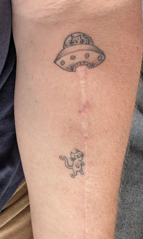 UFO arm tattoo to highlight my scar