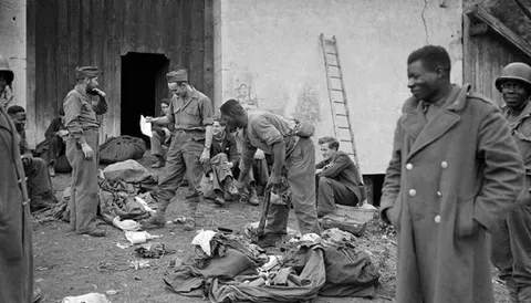 “African tirailleurs removing their uniforms after being dismissed from the French army during the 1944 ‘Whitening’ of the French forces