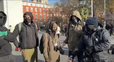 A United Healthcare CEO shooter lookalike competition takes place at Washington Square Park
