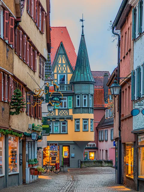 House with a corner turret in Ammergasse 1, university city of Tübingen, Baden-Württemberg, Germany.