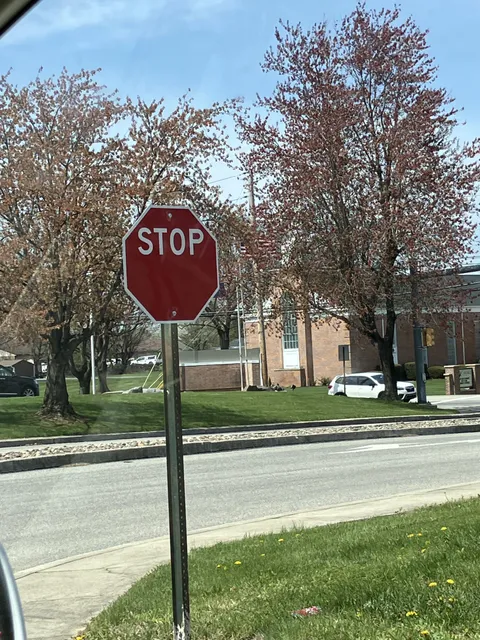 This stop signs “stop” is off centered.