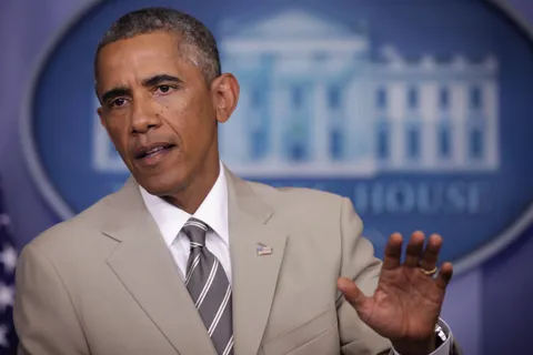 President Obama wears a tan suit at a press conference in 2014