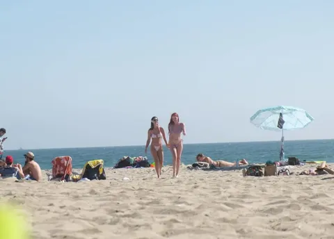 Stealing each others bikini tops
