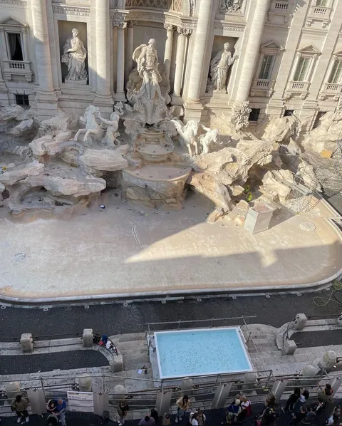 The Trevi fountain in Rome has been emptied and a little pool was put in front of it so tourists could throw a coin.