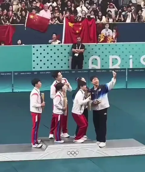 North and South Korean athletes take a selfie together at the Olympics