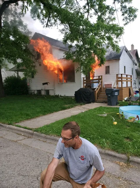 This man saved our dog. You can see our cat jumping out the window.