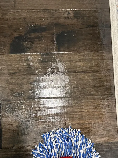 Bare footprint appears when mopping floors in our new house
