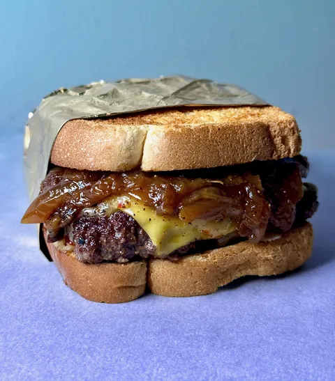 [homemade] Patty melt w/ cheddar, pepper jack, caramelized Walla Walla onions, and homemade white bread.