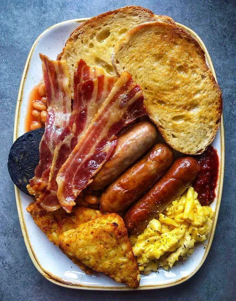 Sausages, eggs, beans, black pudding, bacon and toast