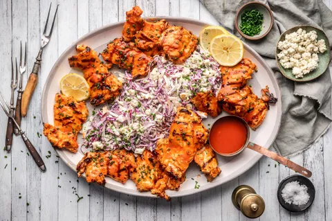 Chicken thighs on sale are often a great deal. These are grilled, Buffalo Style and served with a Blue Cheese Slaw (recipe in comments)