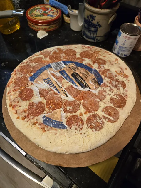 Who thought it was a good idea to put a paper sticker on frozen pizza?