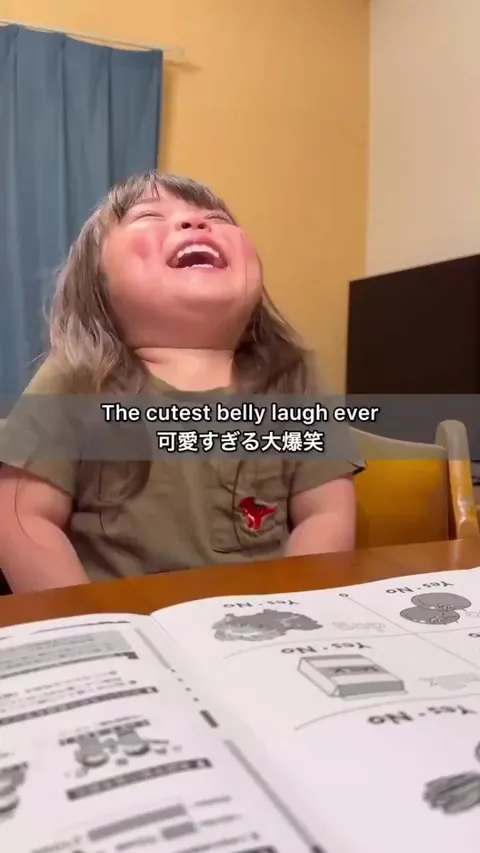 Japanese girl learning English gets the giggles