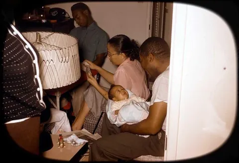 Kodachrome slides from a christmas diner party in the 1950s. It appears the whole family was there