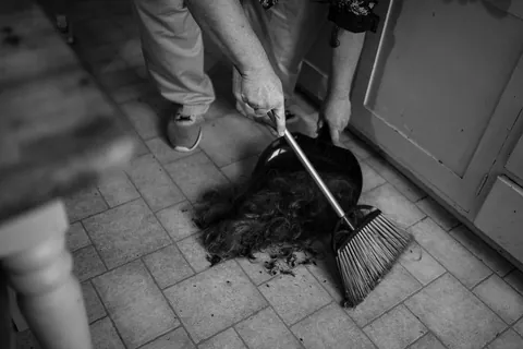 Shaving my head after week one of chemo