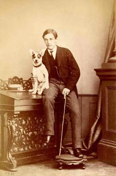 Gentleman pose for photos with their beloved pups, circa 1880-1900