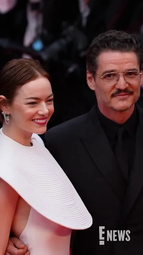 Emma Stone dodges a bee attack on the red carpet