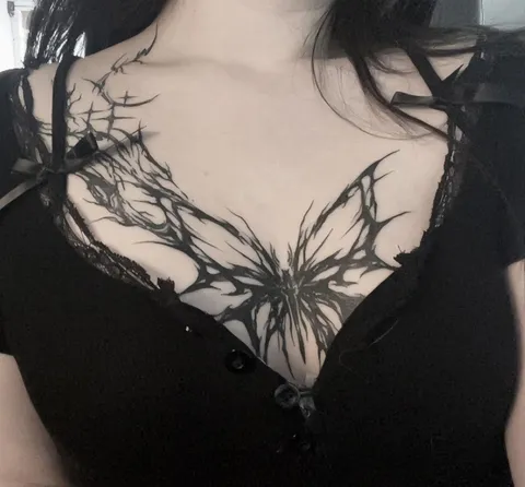 My newest tattoo, a butterfly done in a cybersigilistic style :D