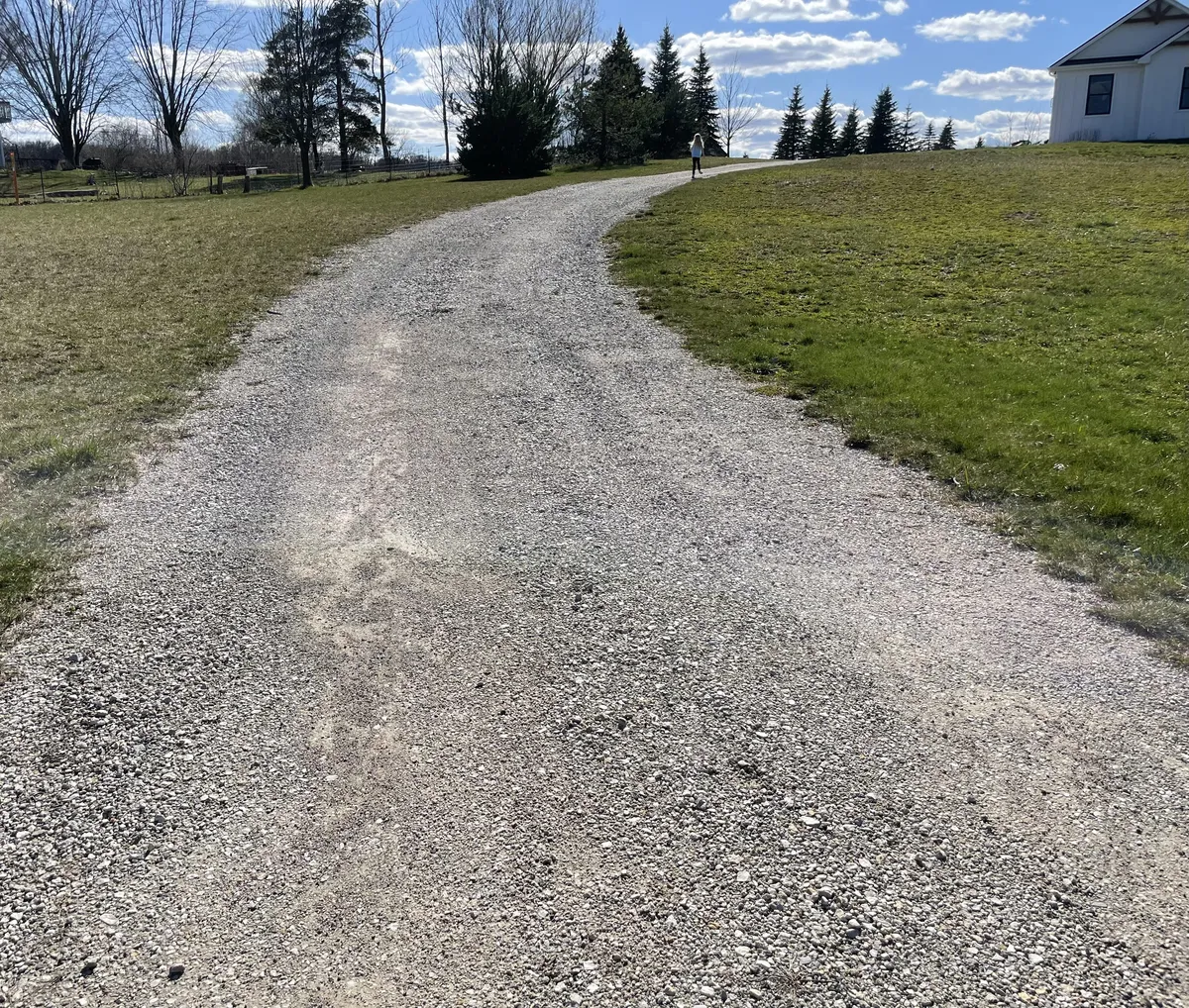 What is the best way to edge driveway? Make sure stones stay in a line and not look so messy. 